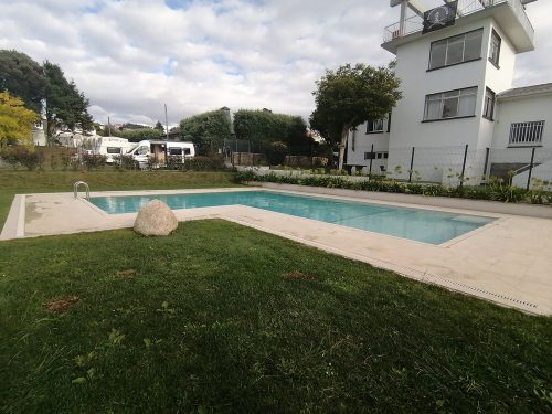 Swimming pool and surf club behind