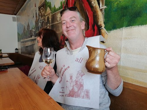 With the typical Bavarian apron