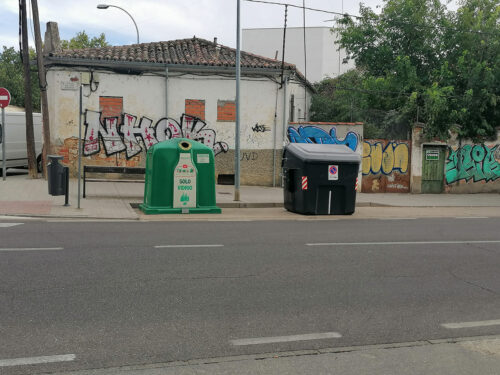 Trash containers in front of the entrance to the area